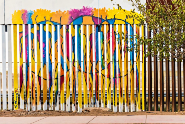 In response to border militarization programs, artists have painted colorful murals on the U.S.-Mexico border wall near Douglas. (Photo by Jeff Smith)