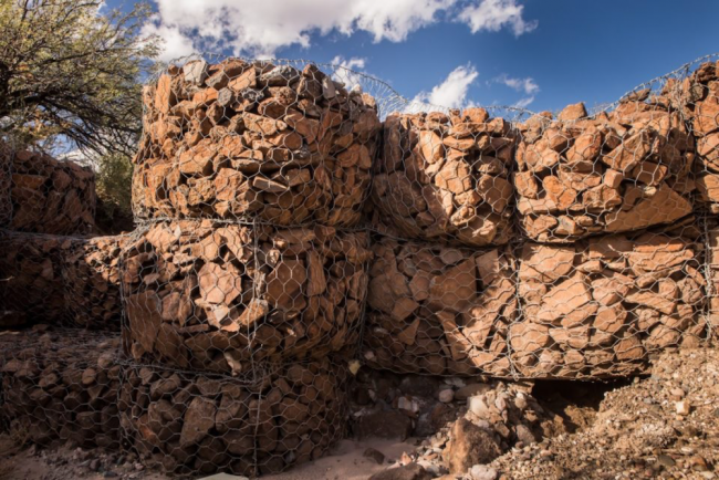 Gabions are rock walls, some as tall as 18 feet, built to be sponges shaped to the contour of the streambed and riverbank, slowing the water and replenishing the soil with life. (Photo by Jeff Smith)