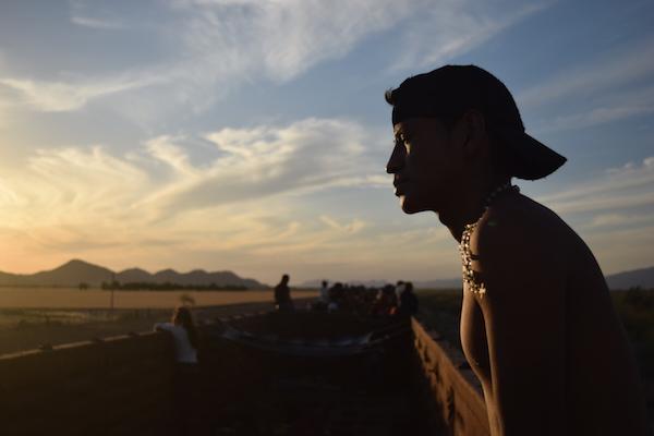 A Viacrucis participant rides atop 