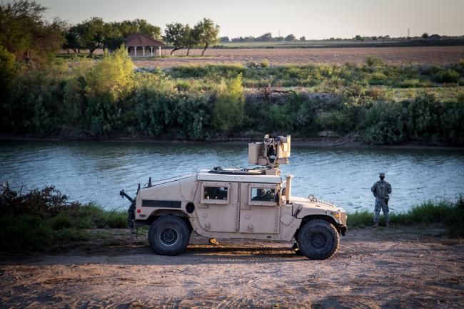 A soldier from the Texas Army National Guard observes a section of the Rio Grande River. (U.S. Army photo by Maj. Randall Stillinger, Flickr)