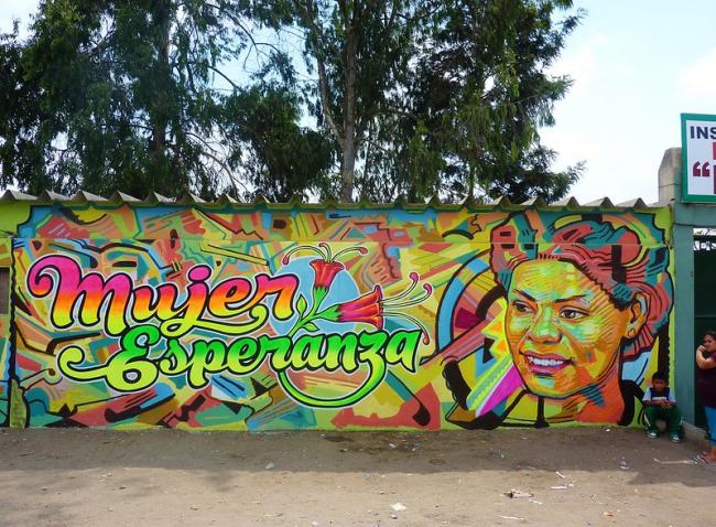 A mural featuring Maria Elena Moyano and the words 