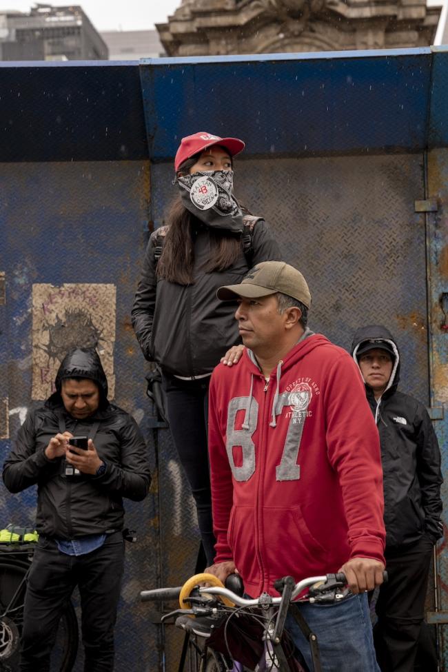 Fifteen-year-old Zoe Juárez García attends the Ayotzinapa anniversary march with her father Miguel Ángel. (Anita Pouchard Serra)