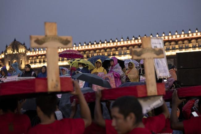 People gather at a march in Mexico City on September 26, 2024, to honor the 43 Ayotzinapa students who were forcibly disappeared 10 years ago. (Anita Pouchard Serra)