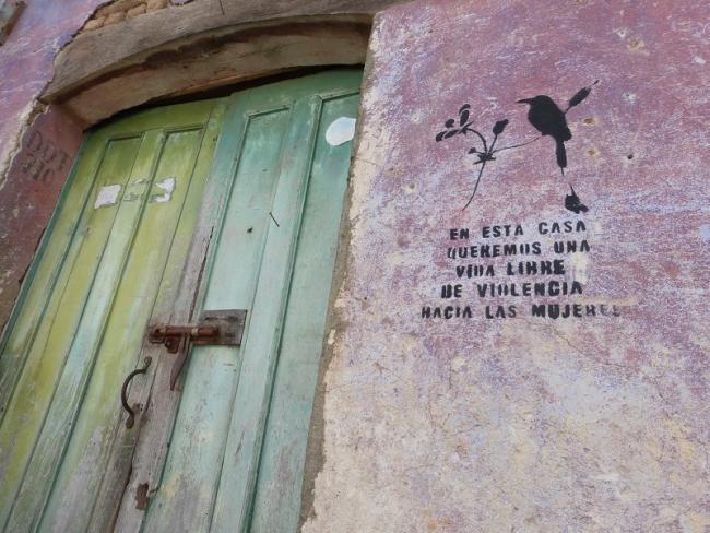 A door in Suchitoto, El Salvador with a stencil reading 