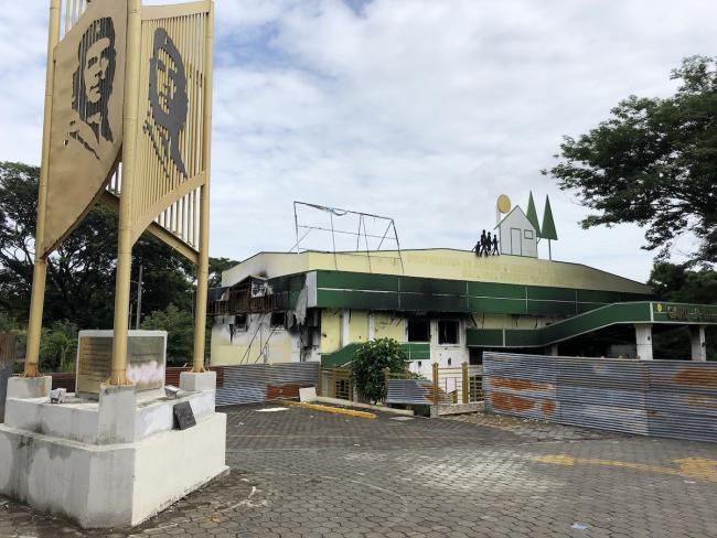 The Cooperativa de Ahorro y Crédito Caja Rural Nacional (CARUNA RL) in Managua seen partially burned during anti-government protests in 2018. (Jonah Walters)