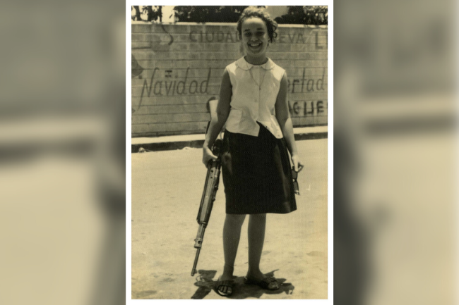 Julia Cabral, a young girl who posed with her brother's rifle and whose image was popularized as 