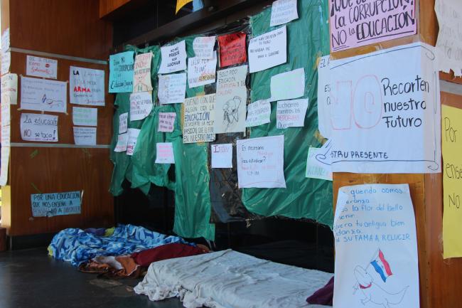 Students occupied the vice-chancellor's office at the National University of Asunción. They kept guard day and night outside the entrance and covered the building with protest posters. (William Costa)