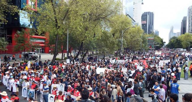 An estimated 30,000 people protested in Mexico City to commemorate the two year anniversary of the disappearance of the 43 Ayotzinapa students (Photo: Peace Brigades International)