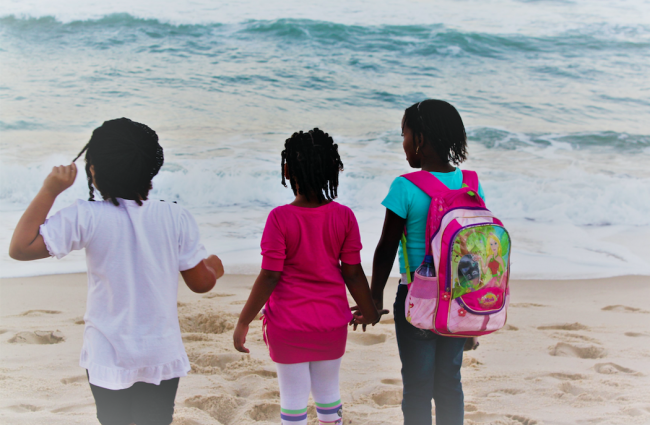 Laryssa (left), Duda (middle), and Gabriela (right) gaze at the water. (Katia Costa Santos)