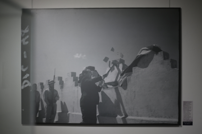 The historic image in the National Museum of Costa Rica of José Figueres Ferrer symbolically destroying a wall of the military barracks as he abolished Costa Rica's military in 1949. (Michael Fox)